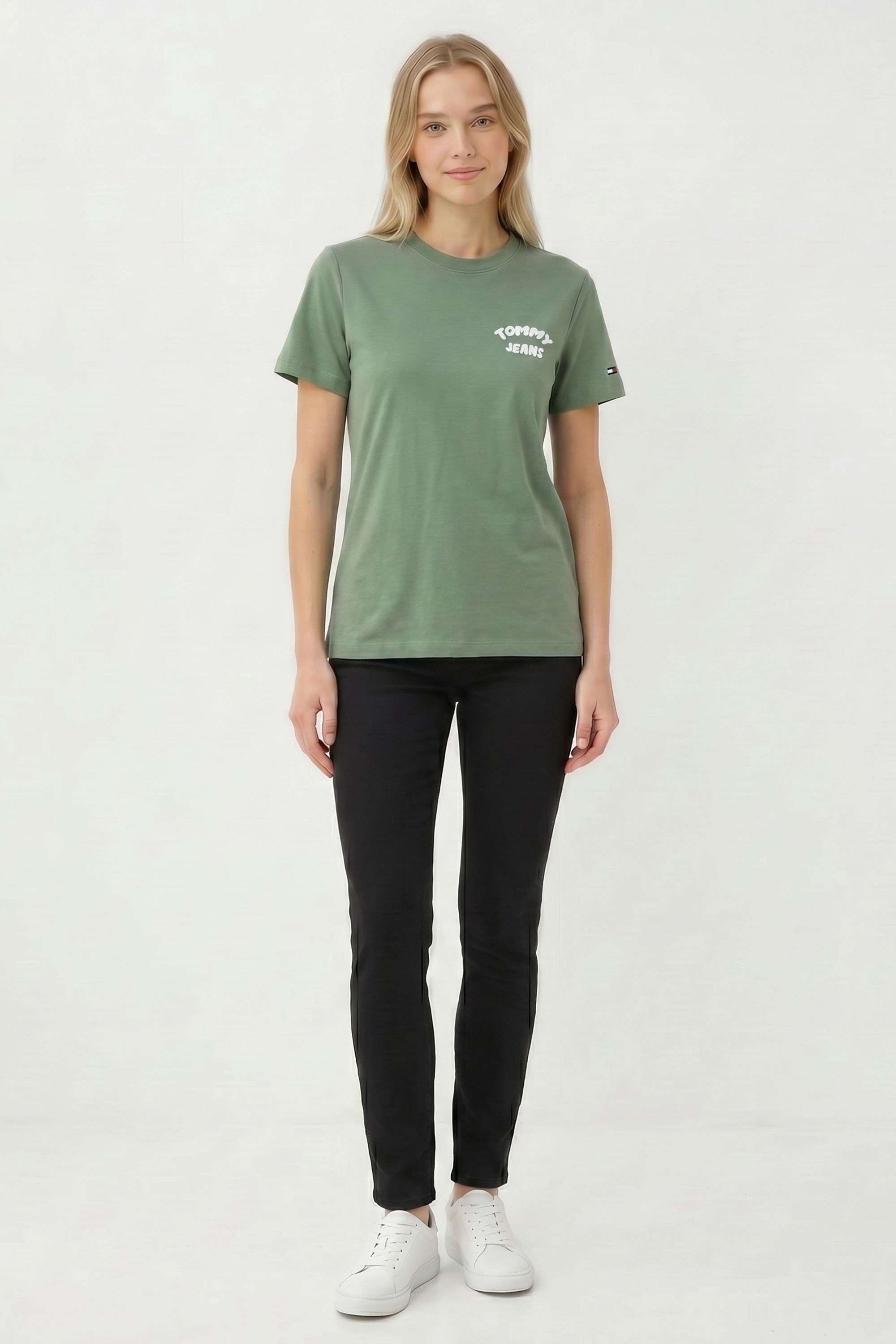 green t shirt with black jeans
